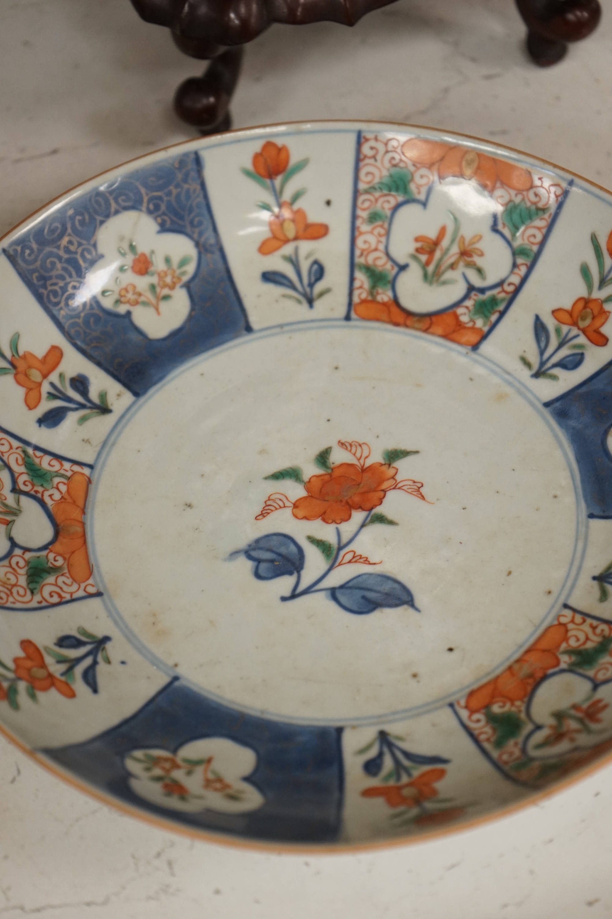 An 18th century Chinese export Imari pattern dish together with other Chinese blue and white ceramics, a hardwood stand and a bone calligraphy brush. Condition - varies